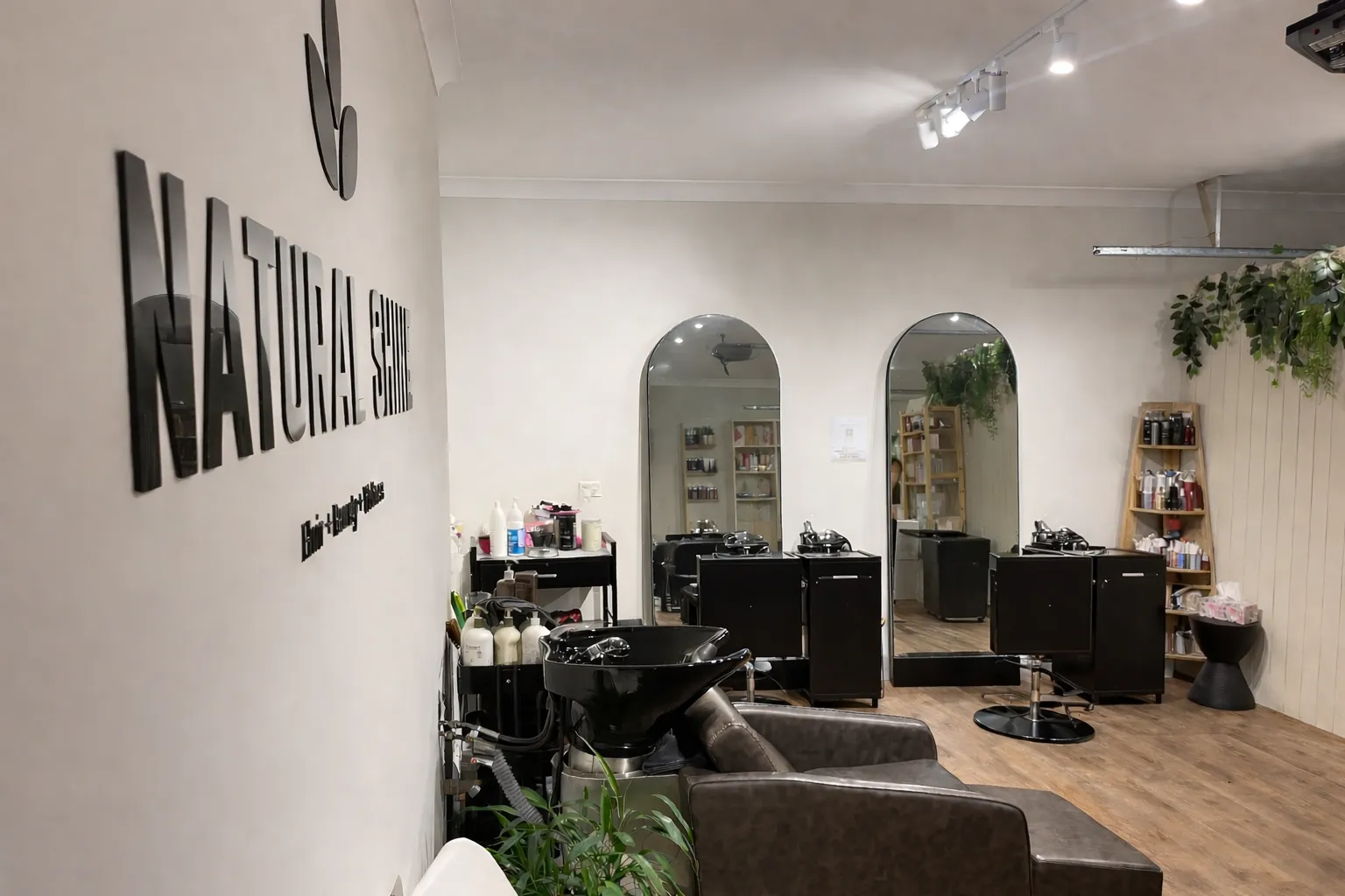 The Natural Shine Hair & Beauty salon floor in North Kellyville, styled as a calm, low-tox space