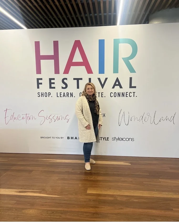 Our stylist at the Hair Festival education event, where the Natural Shine team keeps training