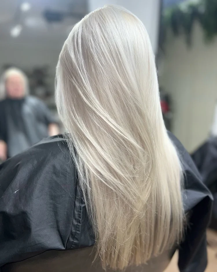 Platinum blonde lengths lightened with low-tox colour at our North Kellyville salon