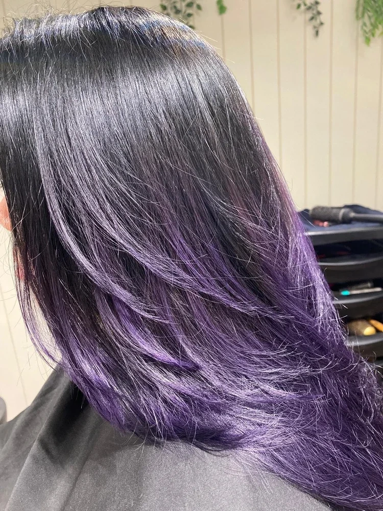 Purple ombre colour melt through layered hair, created with ammonia-free colour